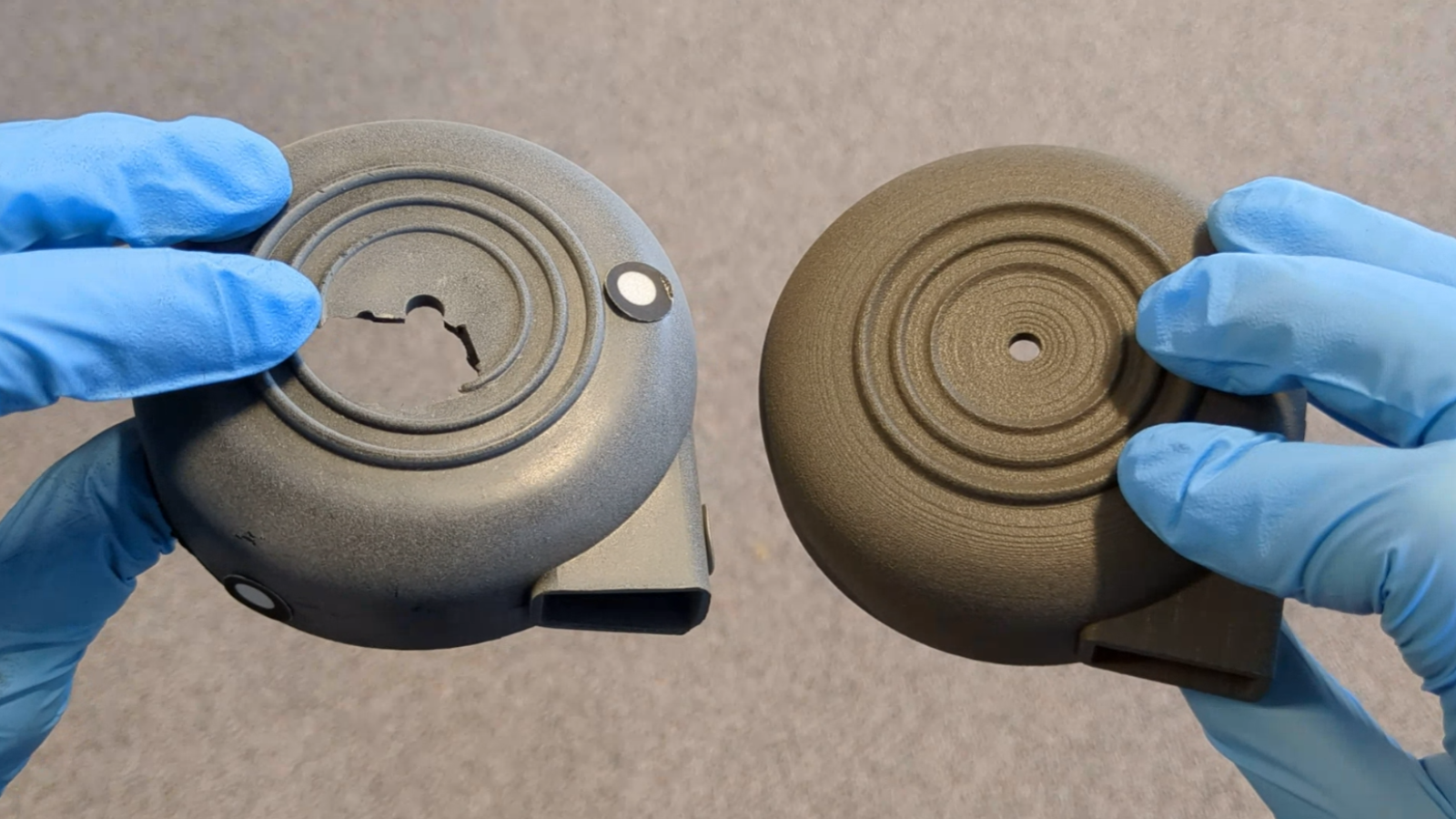 Broken original air intake cover next to 3D printed version